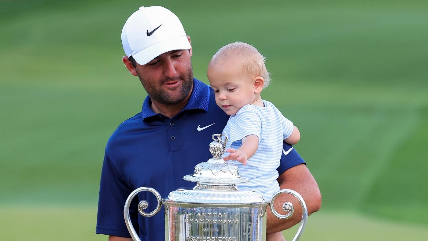 Scottie Scheffler Takes on Dad Duties While Signing His Scorecard After Winning PGA Championship