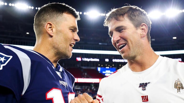 Tom Brady and Eli Manning Reignite Their Rivalry at Fanatics Fest with WWE-Style Showdown